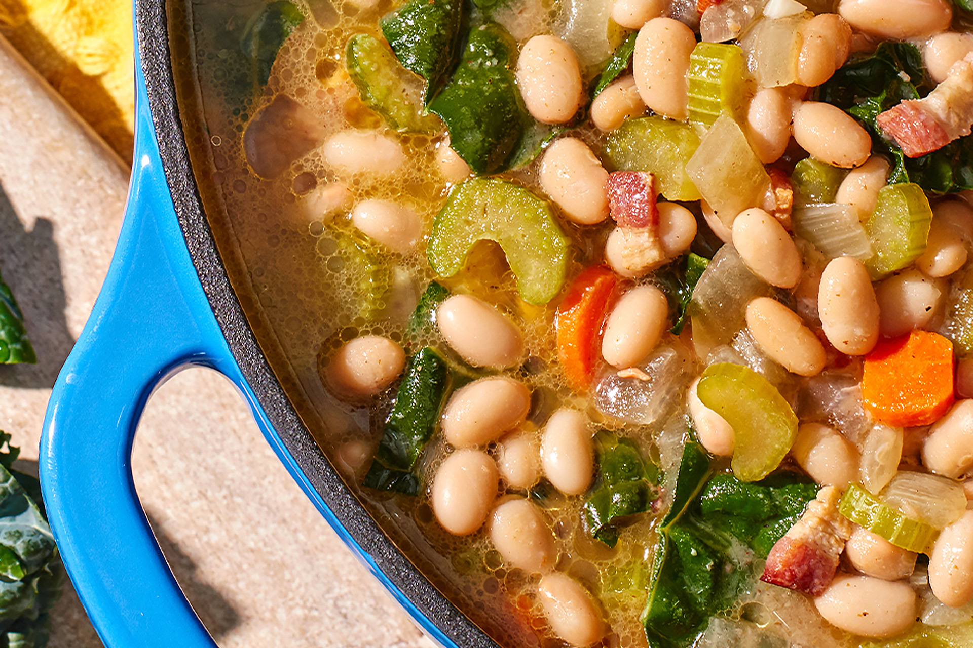 Close-up up of Navy Bean soup in a blue Dutch oven