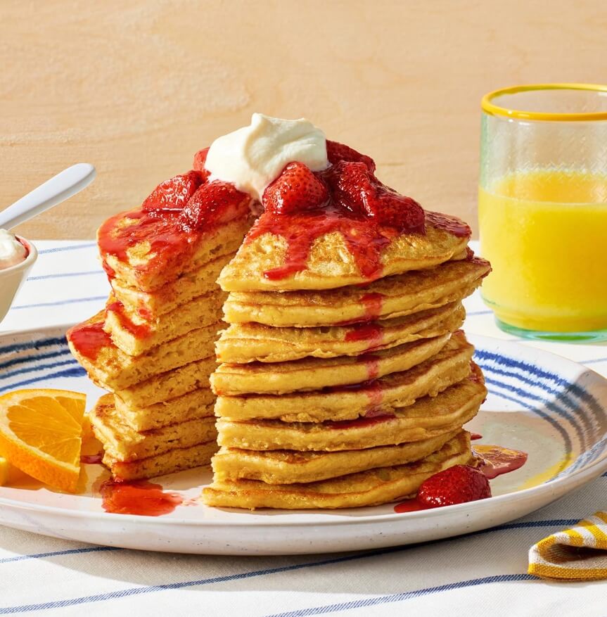 Chickpea or garbanzo bean pancakes with strawberries and cream.