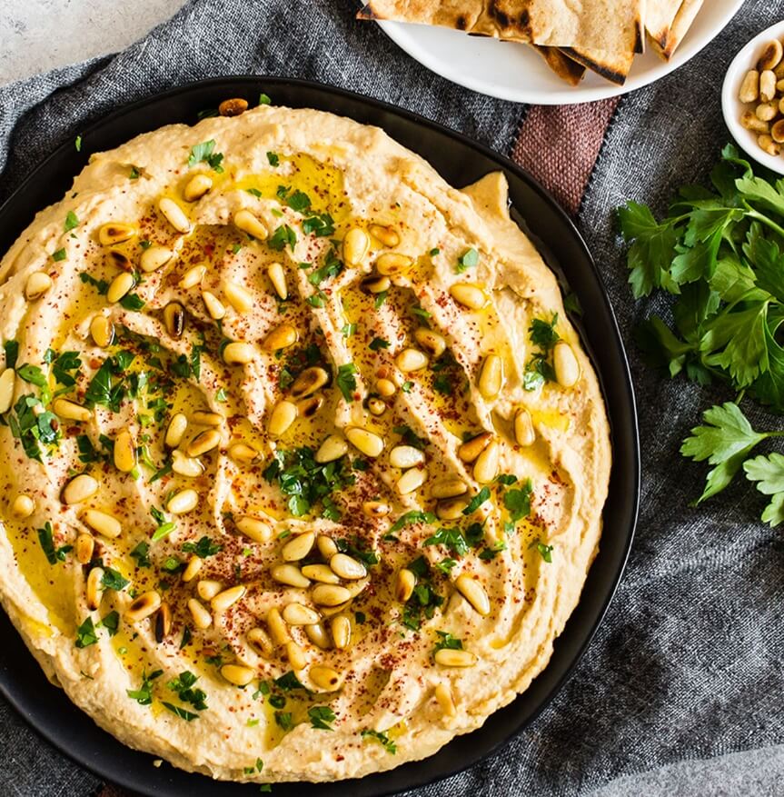 Chickpea or garbanzo bean hummus with pine nuts, parsley, and spices.