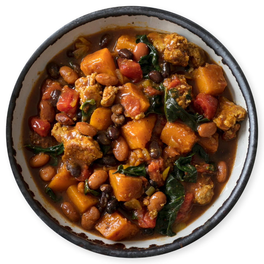 A top down view of a bowl of chunky soup