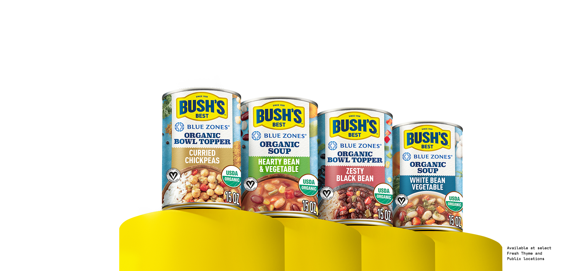 Several cans of Bush's Beans Blue Zones style beans on yellow pedestals.