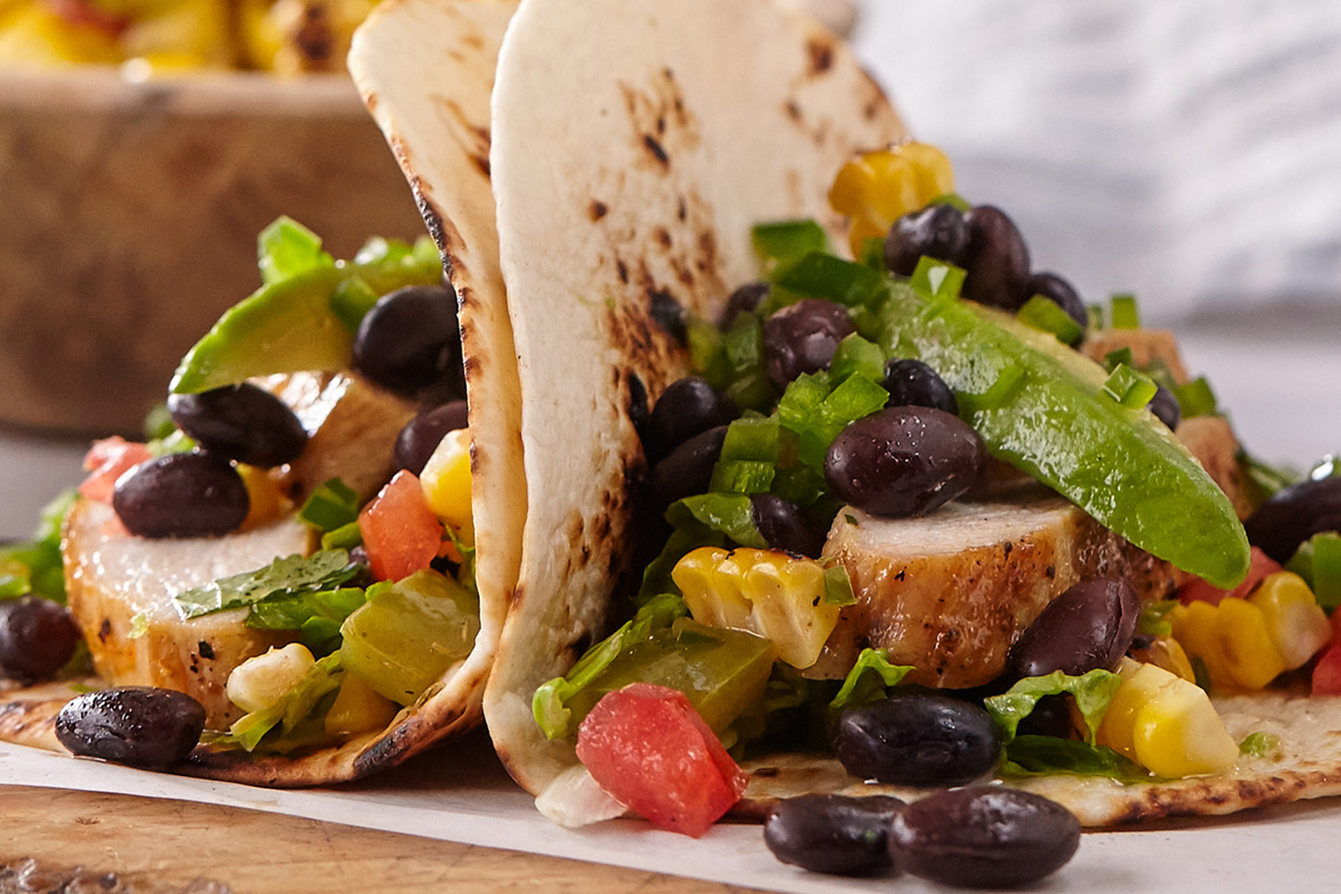 Chicken tacos with black beans and tomato salsa