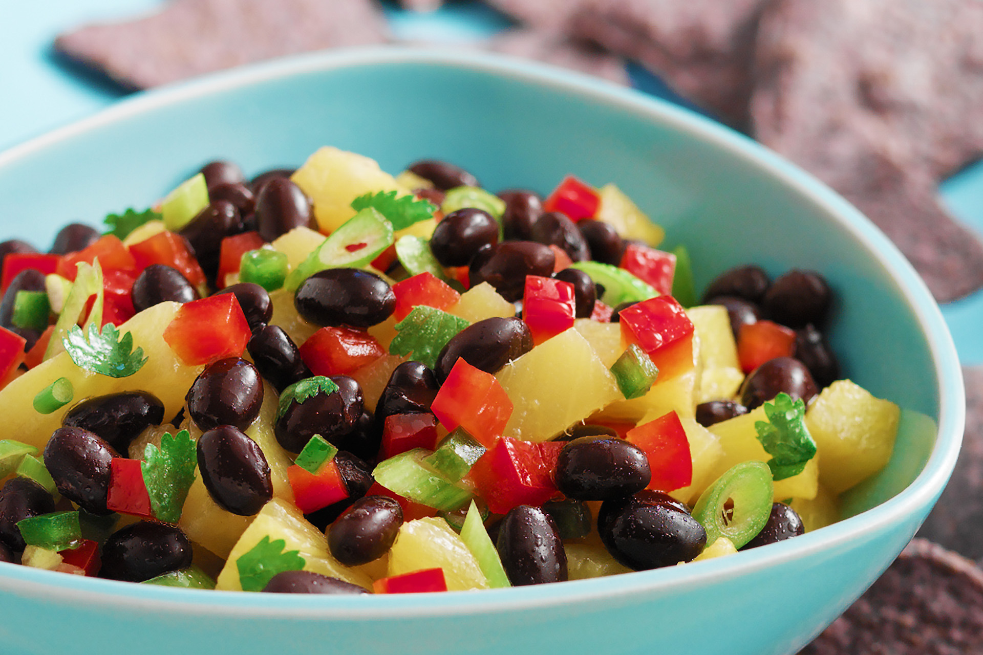 Close-up of black bean salsa with tomato and pineapple