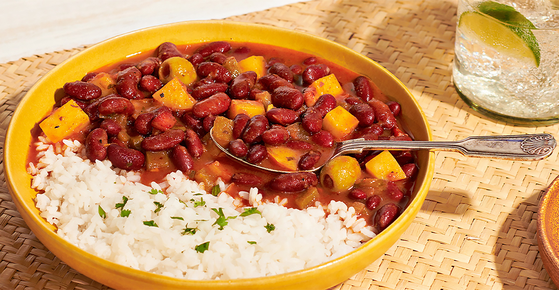 Red beans and rice with vegetables in a yellow bowl