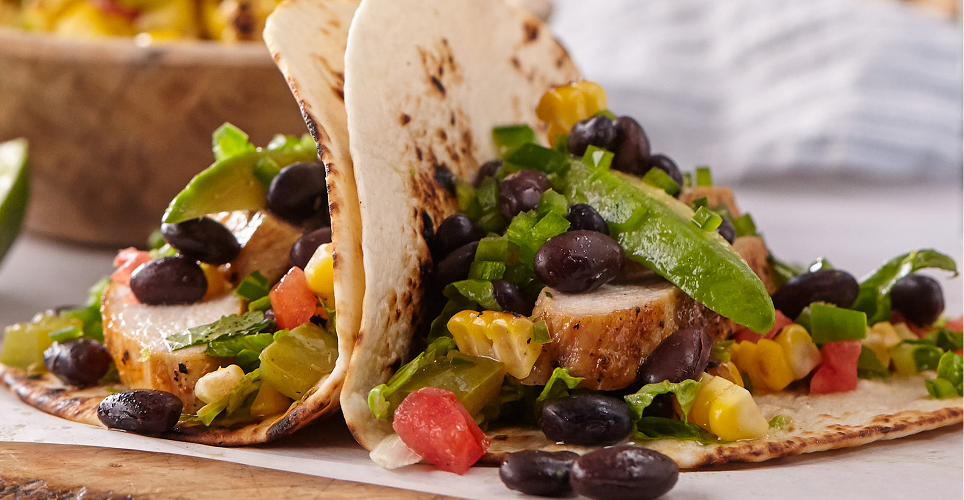 Chicken tacos with black beans and tomato salsa