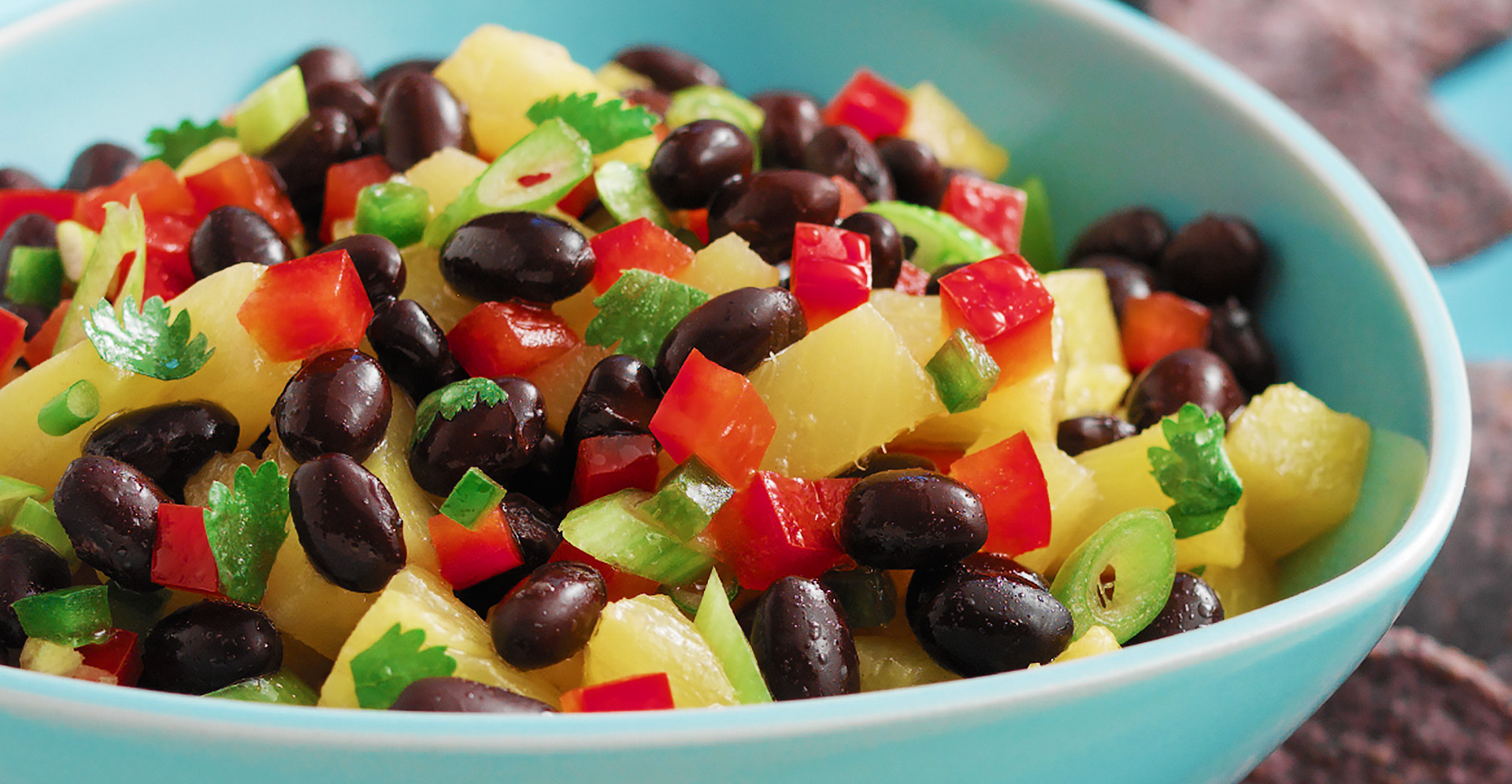 Close-up of black bean salsa with tomoato and pineapple
