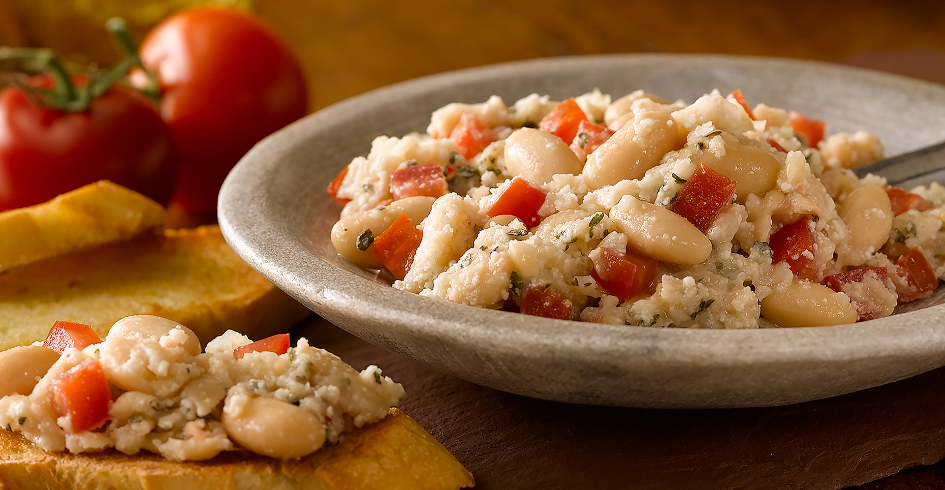 White bean bruschetta topping with one piece of bruschetta