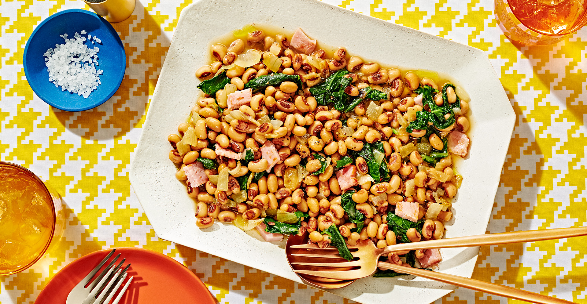 Blackeye peas and collard green stew on white platter