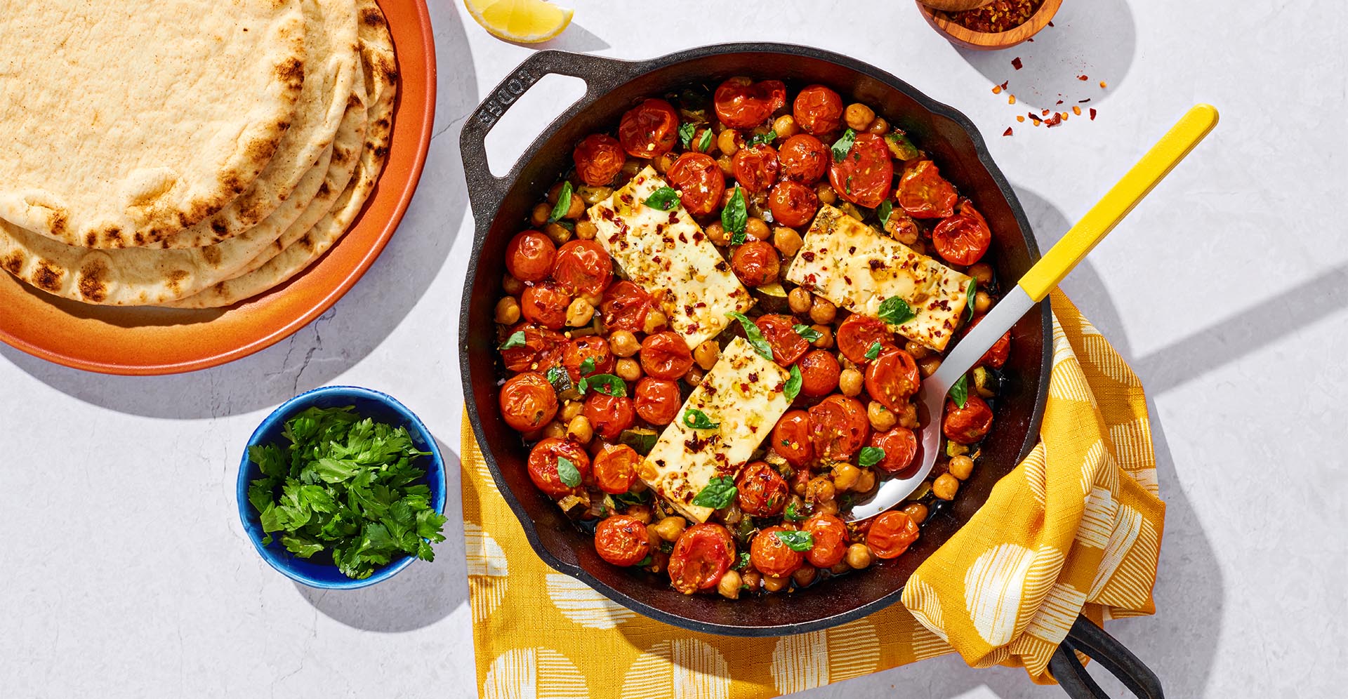 Chickpeas and mixed vegetables sauted in olive oil and baked with feta cheese. Served with warm pita and lemon wedges