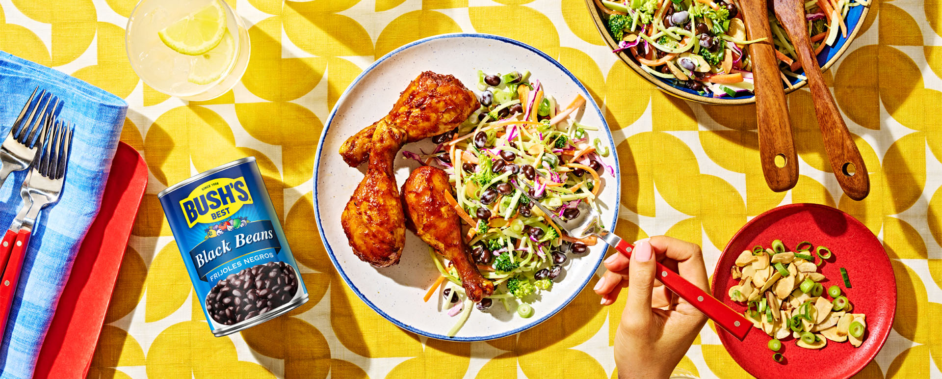 Black bean and broccoli salad served as a side with barbecue chicken legs