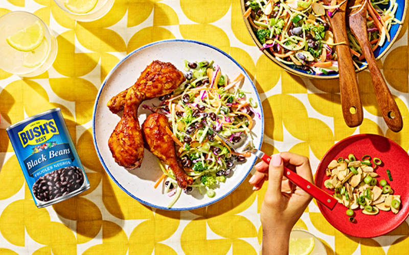 Black bean and broccoli salad served as a side with barbecue chicken legs