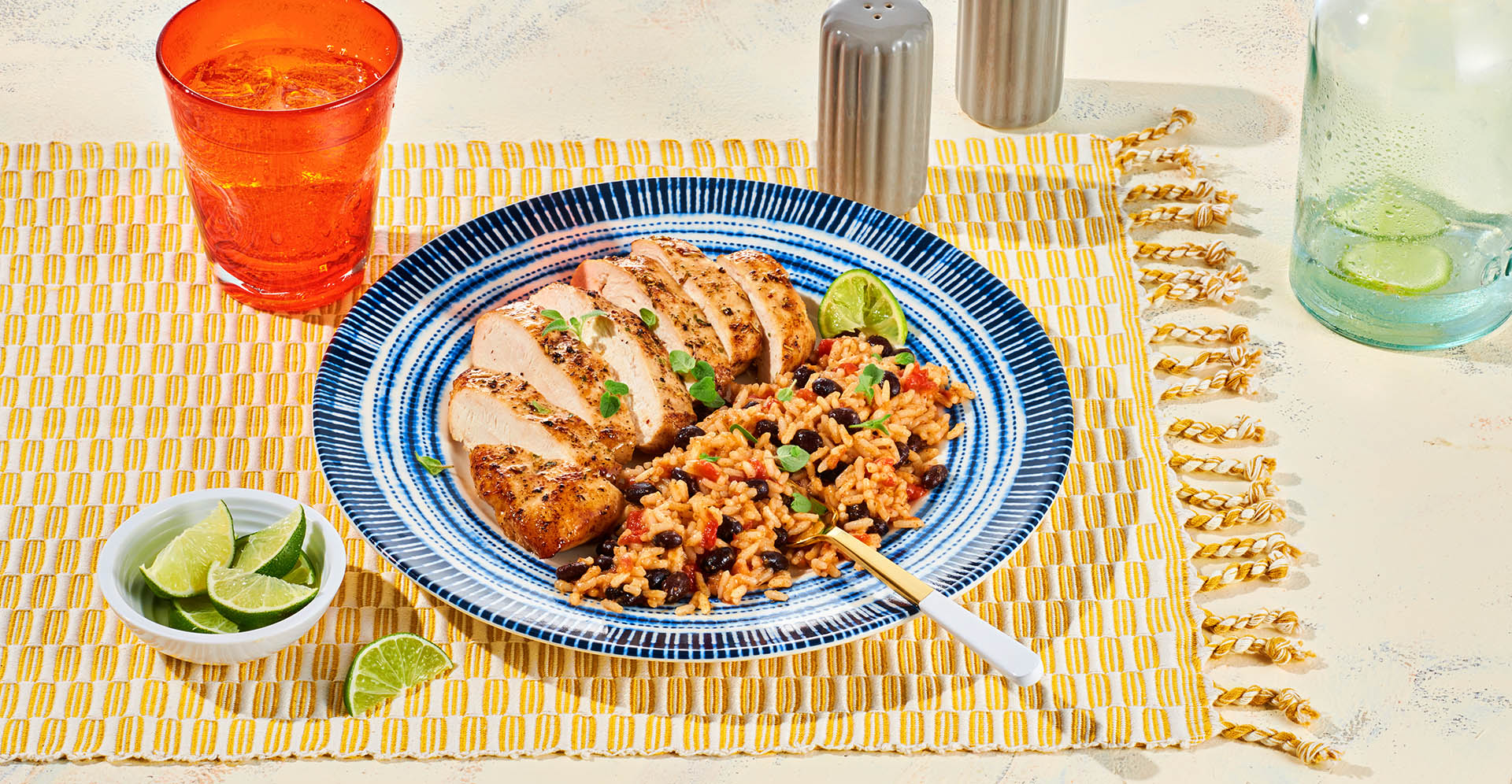 Blue plate with Southwest Black Bean Chicken and Rice.