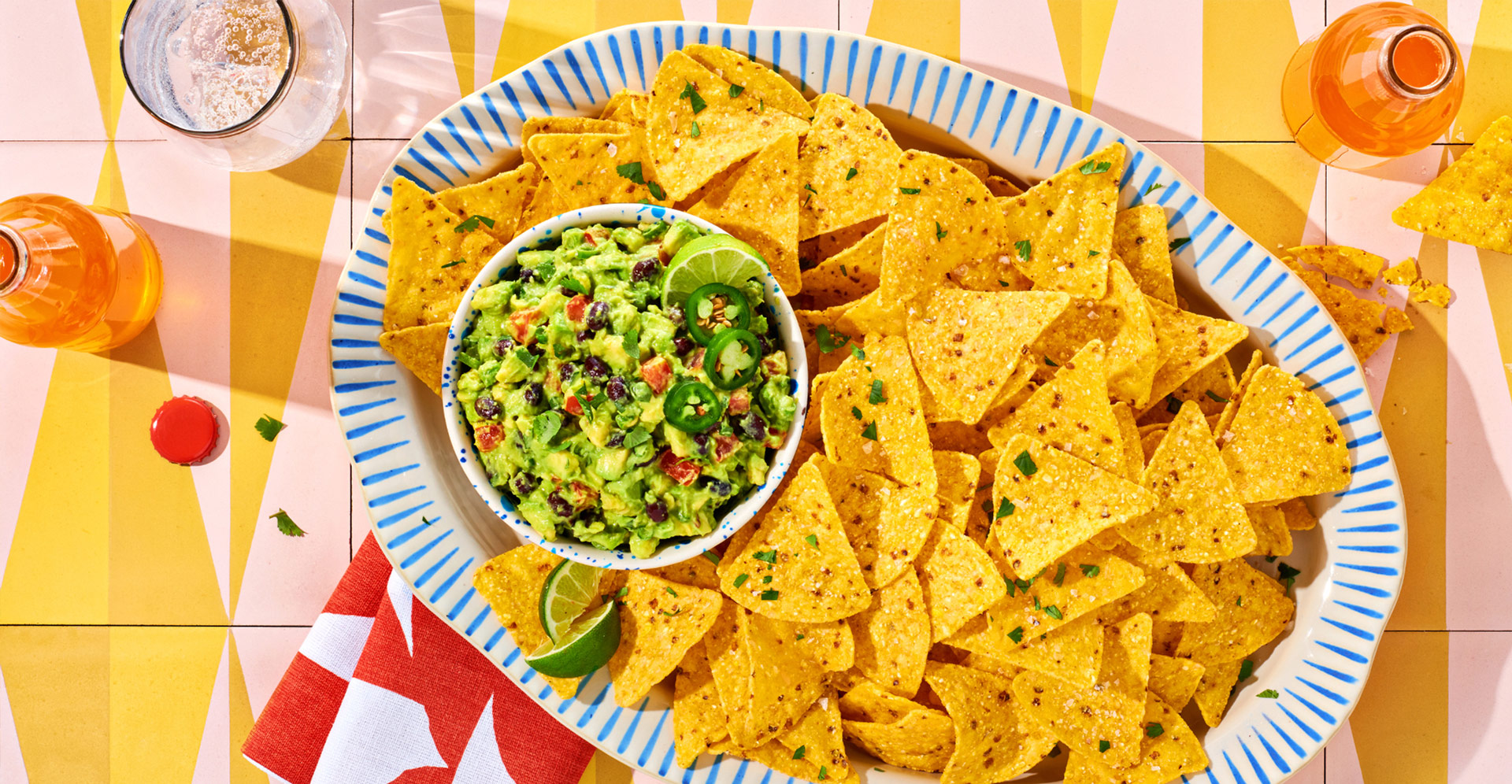 Close up of black bean and avocado guacamole on a festive plate